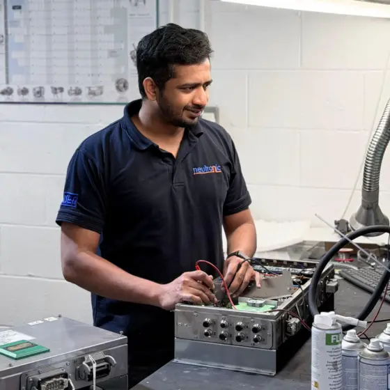 Neutronic Technologies engineer performing LJU Automation repairs and fault-finding on industrial electronic control systems and automation equipment in a specialist UK workshop.