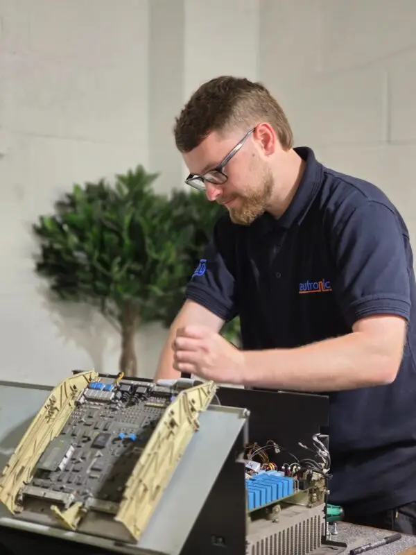Industrial Electronic Repair engineer testing and repairing industrial control electronics and automation equipment at Neutronic Technologies UK workshop