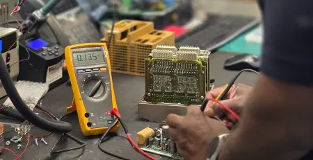 PLC repair engineer testing industrial automation and programmable logic control systems at Neutronic Technologies